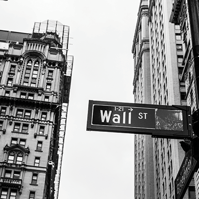 Sign of Wall Street with buildings in the background